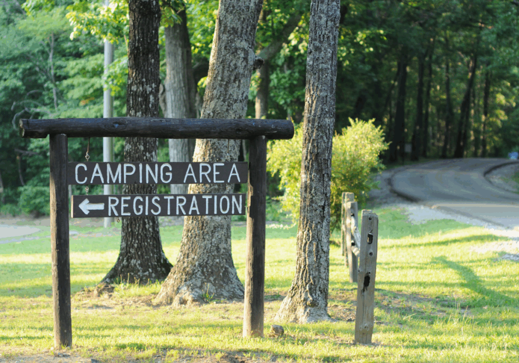 camp area sign point toward registration